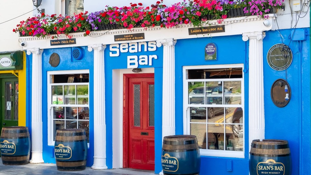 Sean's Bar in Athlone, County Westmeath, recognised as one of Ireland's oldest pubs and adorned with colourful flowers.