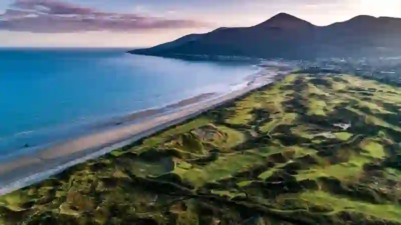 Royal County Down Golf Club in County Down with links fairways, beach and Mourne Mountains.