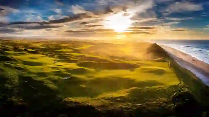 Royal Portrush Golf Club in County Antrim with coastal links and lighthouse on the Atlantic coast.
