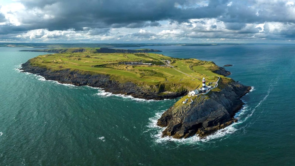Aerial view of Old Head Golf Links in County Cork overlooking dramatic cliffs and the Atlantic Ocean.