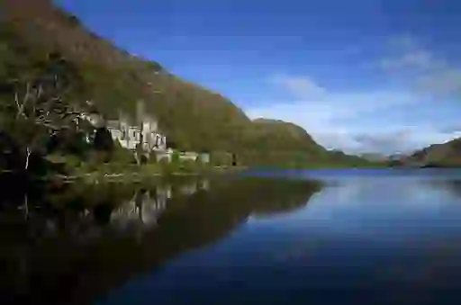 Kylemore Abbey reflected in the still waters of Pollacapall Lough, Connemara.