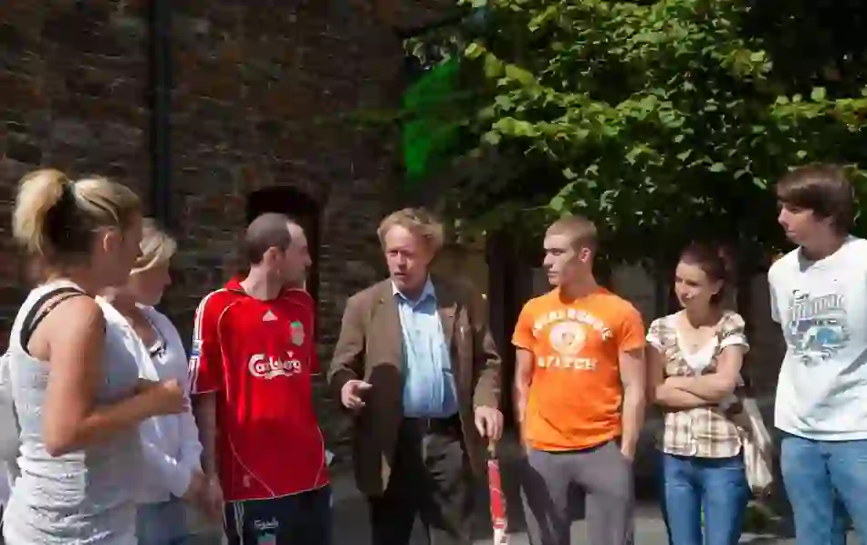 Guide leading a walking tour with visitors in Waterford city.