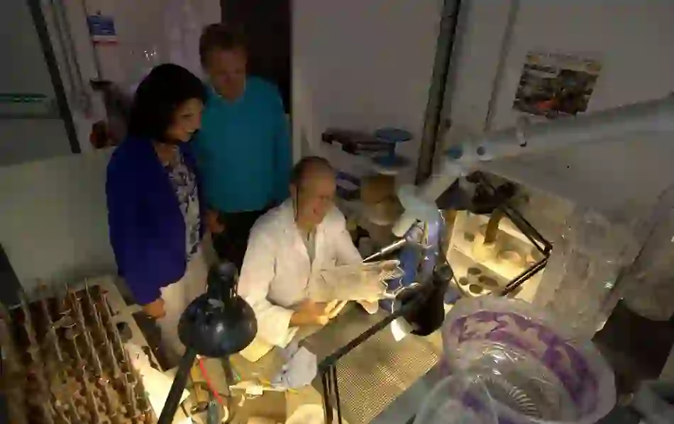 Glass cutter demonstrating crystal craft at the House of Waterford.