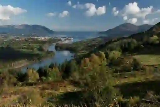 Panoramic view of Newry and Carlingford Lough surrounded by rolling hills and mountains.